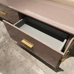 Elegant Curved TV Stand with Textured Panels, Cream Frame and Brushed Gold Hardware